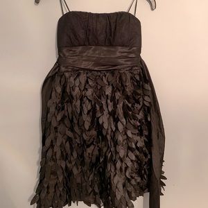 Black formal dress with feathered skirt.